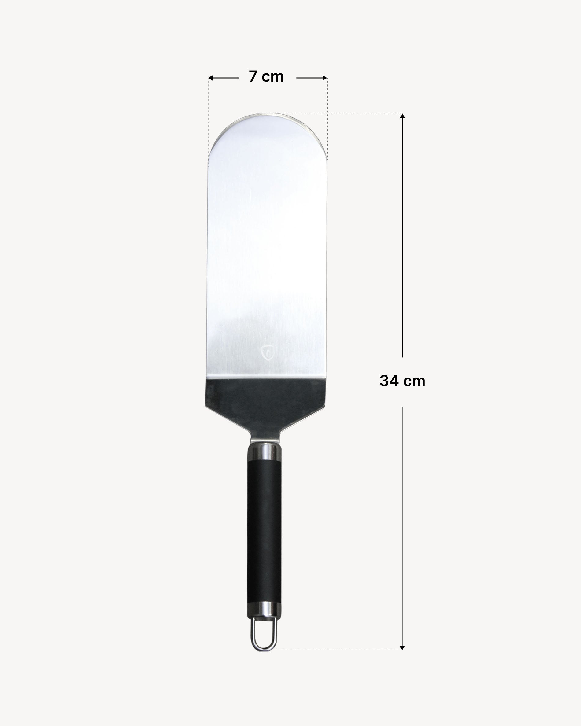 Spatule poisson en inox avec lame arrondie et manche ergonomique noir, présentée sur fond clair avec indication des dimensions : largeur de lame de 7 cm et longueur totale de 34 cm.